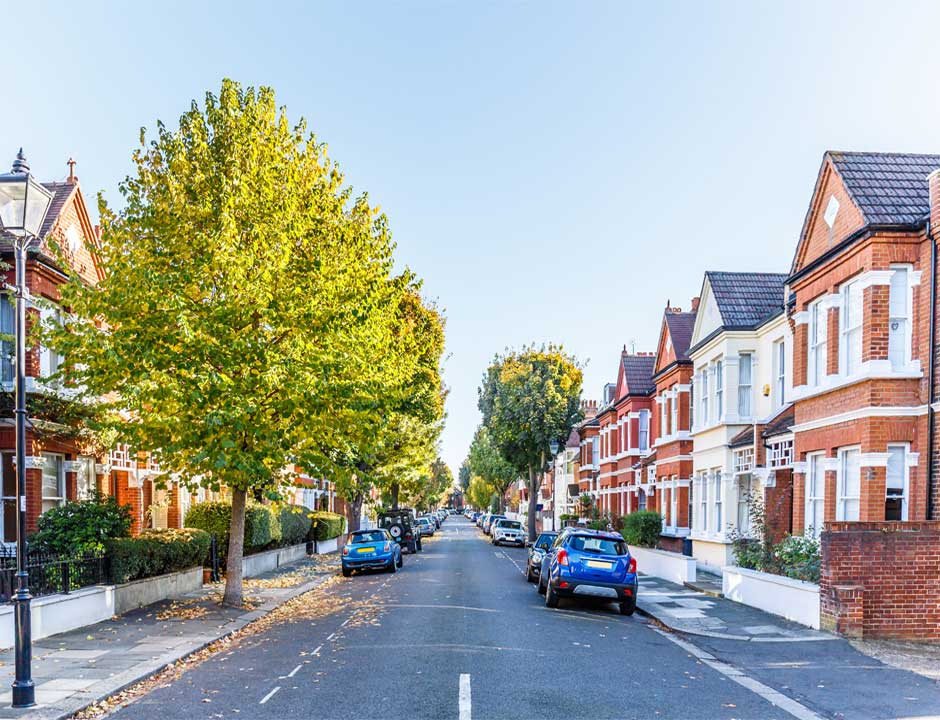 A female house clearance valuer at a front door, ready to help across Hertfordshire, London and the home counties