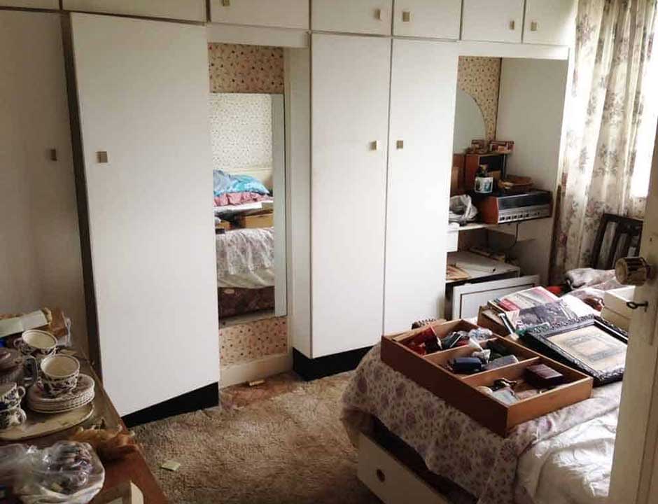 A bedroom before a house clearance