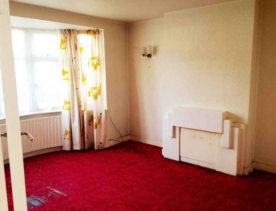 The same living room cleared and swept after a house clearance